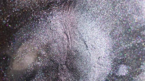 Sparkling Glitter Background Texture with Silver and Purple Hues