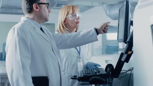 Scientists Collaborate in Modern Laboratory Setting