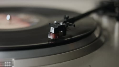 Record Player Needle on Spinning Vinyl Record