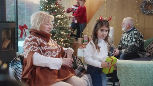 Multi-Generation Family Celebrates Christmas Together at Home