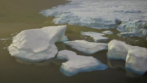Aerial View of Floating Icebergs Near Glacier in Cold Environment