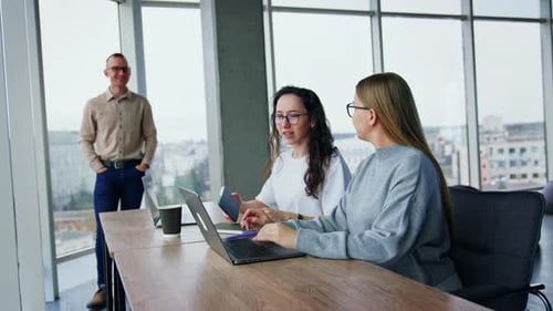 Adults Collaborating in Modern Office Space