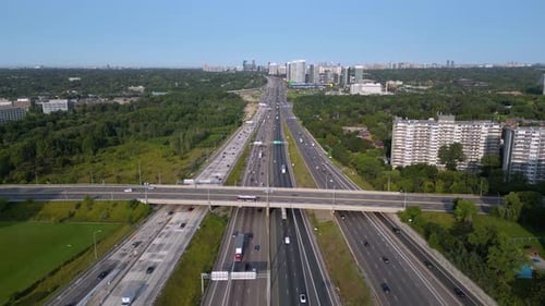 Busy freeway with vehicles driving during daytime commute and transportation of goods