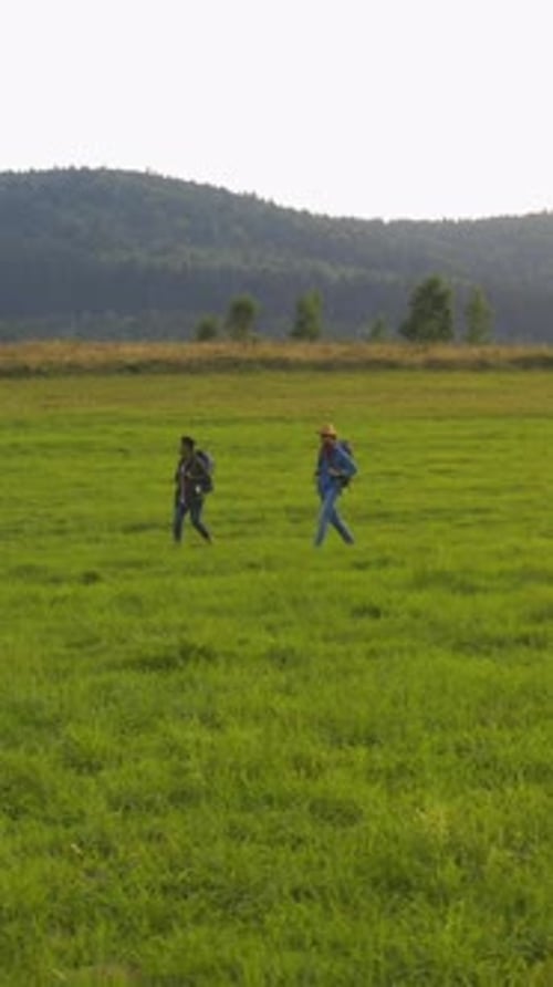 Couple of Multiethnic Travelers Hiking in Grorious Mountain Nature Family Trip Summer Natural