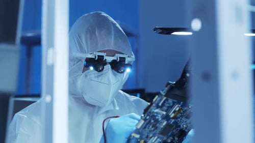 Professional Engineer is Developing a Modern Microprocessor in a Futuristic Laboratory Using