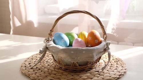 Easter Colorful Eggs in Busket on White Wooden Table