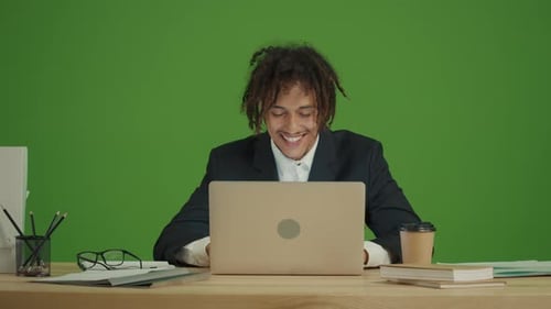 Young Adult in Business Suit Working Remotely