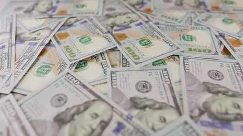 Pile of US One Hundred Dollar Bills