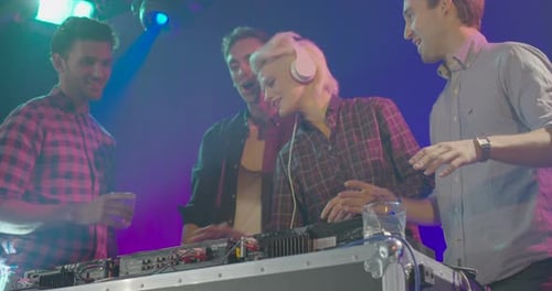 Happy Friends Enjoying Party with DJ