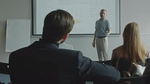 Business Expert Giving Presentation on Corporate Seminar