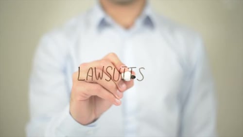 Lawsuits, Man Writing on Transparent Screen