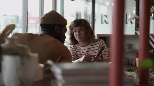 Young Couple Cafe Phone Use
