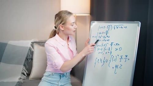Woman Teaching Math at Home with Whiteboard