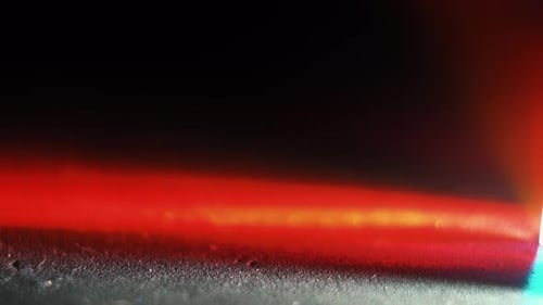 Colorful abstract background texture with flashing lights from the light ray reflections of a crysta