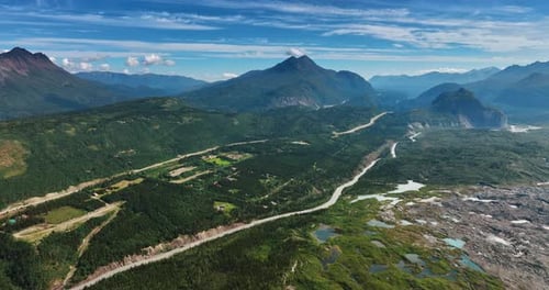 Rocky landscape of Alaska with some marshy parts. Gorgeous verdant mountains from drone footage.