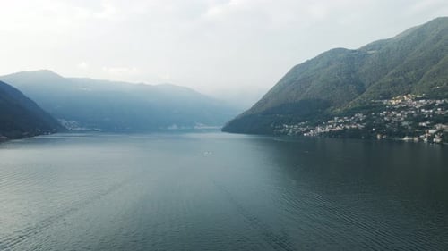 A drone shot circling around of the center of Lake Como in Italy.