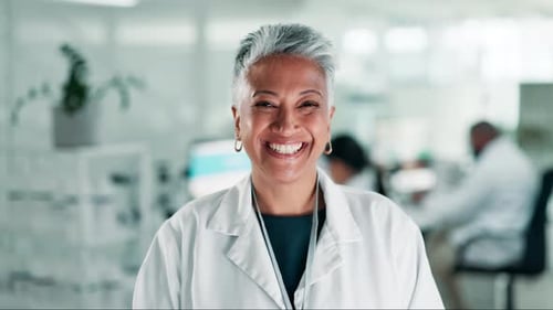 Smiling Scientist in Lab Coat in Modern Laboratory