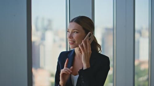 Attractive Businesswoman Making Call in Glass Office Woman Lawyer Speaking Cell