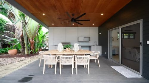 Luxury Outdoor Sitting Area Patio on Raised Plastic Deck and Wooden Ceiling. Exterior of House Home