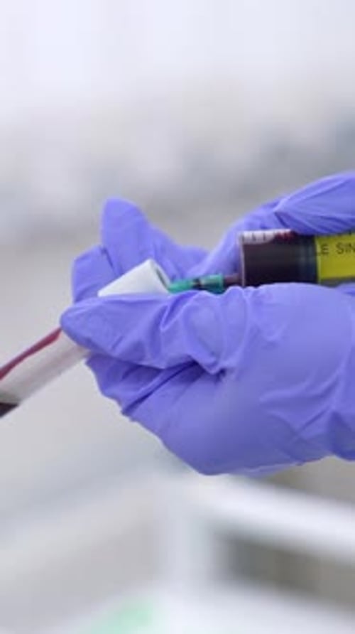 Gloved Hands Prepare Medical Injection