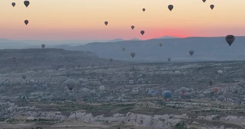 Aerial Cinematic Drone View of Colorful Hot Air Balloon Flying Over Cappadocia