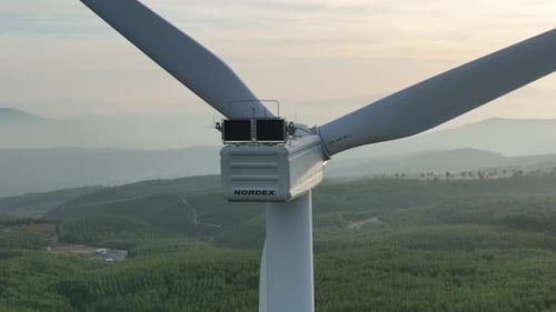 Aerial View Of Wind Turbine Among Hills