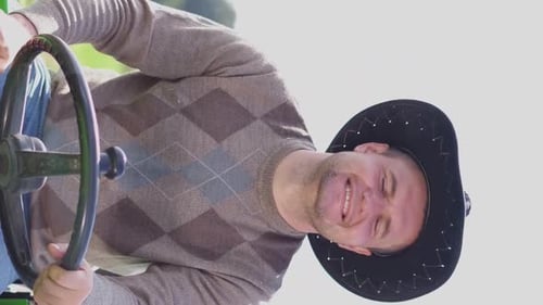 Farmer on a Mini Tractor Driving on the Field Cultivation of Vineyard Plantations Vertical Video