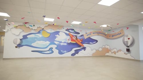 Kindergarten Interior with Airplane Mural and Paper Airplanes