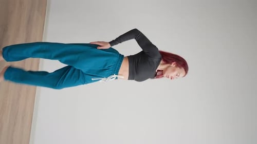 Woman Performing Modern Dance Moves in Studio