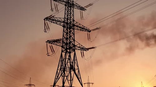 High-Voltage Power Lines at Sunrise or Sunset