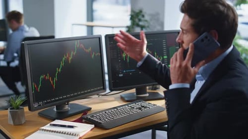Stressed Trader Calling Cellphone Complaining Financial Loss at Office Closeup