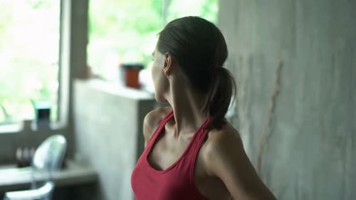 Woman in Red Tank Top Stretches Her Neck
