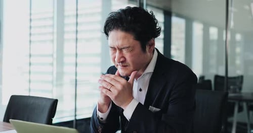 Asian man, stress and neck pain in office with fatigue, muscle tension and burnout at tech