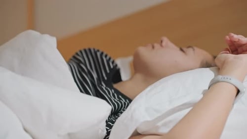 Guest From Various Backgrounds Naps Peacefully in Cozy Hotel Room Guest of Mixed Heritage Enjoys