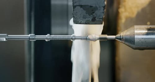 Slow motion macro of specialist is working on production of different gearing details in a worksho