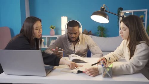 University students of different races study in harmony at home.