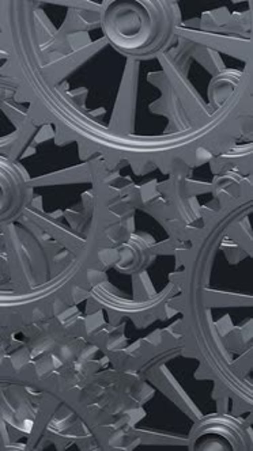 Intricate Array of Rotating Interlocking Metal Gears in CloseUp View