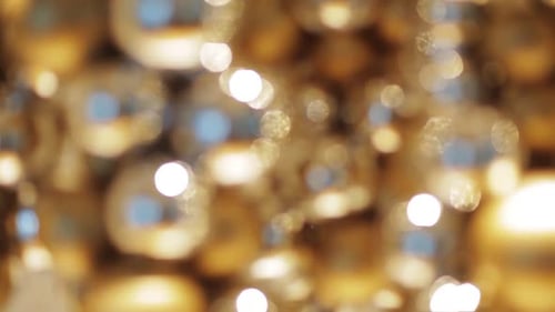 Blurred Golden Ornaments with Sparkling Bokeh Lights