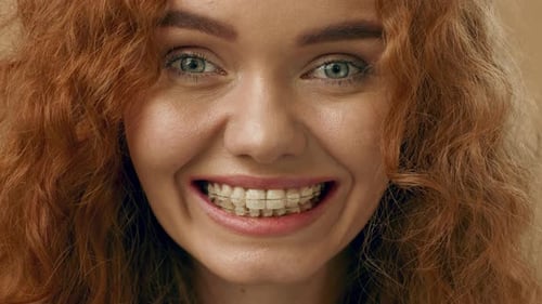 Smiling Young Woman with Braces Close Up