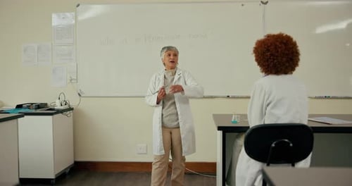 University, biology and teacher with students in classroom for learning