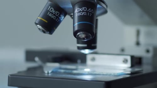 Closeup of Scientific Microscope Laboratory in Hospital Epidemic Disease Healthcare Vaccine Research