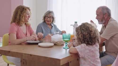 Multi-Generational Family Enjoying Brunch Together at Home