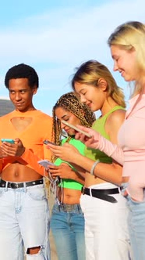 Friends Using Smartphones Together Outside