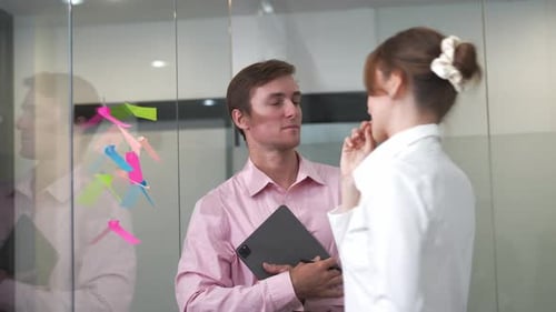 Business people, conversation and brainstorming on glass in office for agenda and surprise by ideas.