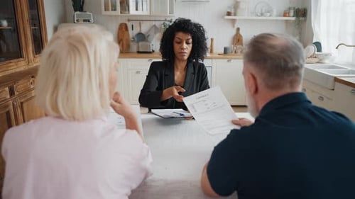 Consultation with Real Estate Agent Sale or Purchase New House with Mortgage Senior Married Couple