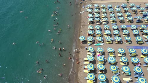 Aerial View of a Picturesque Beach on the Mediterranean Coast During High Season with People