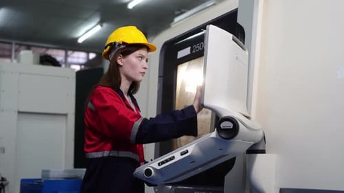 Female Engineer Works on Modern Industrial Machine