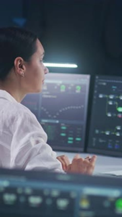 Female IT Technical Specialist Works on Computer with Data Server