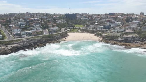 Narrow Beach Of Tamarama In Mackenzies Bay With Eastern Suburbs In Background, Sydney, New South Wal