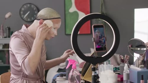 Adults Applying Makeup at Table in Studio Setting
